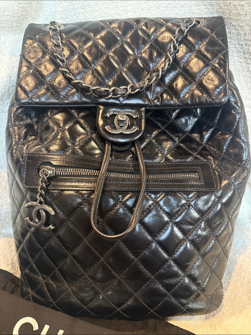 CHANEL Black Quilted Lambskin Drawstring Backpack with Chain